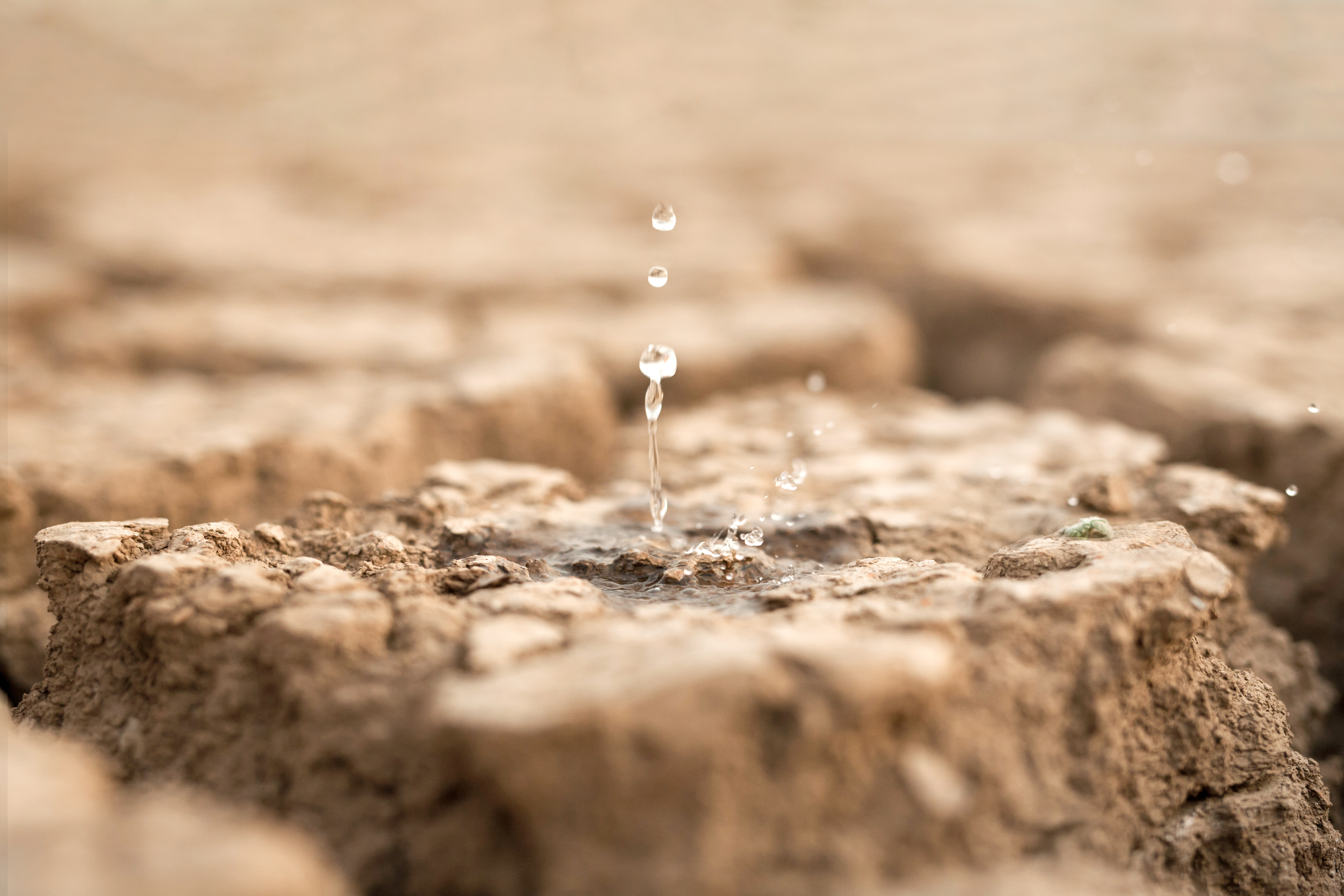 Water droplet bouncing off a rock surface